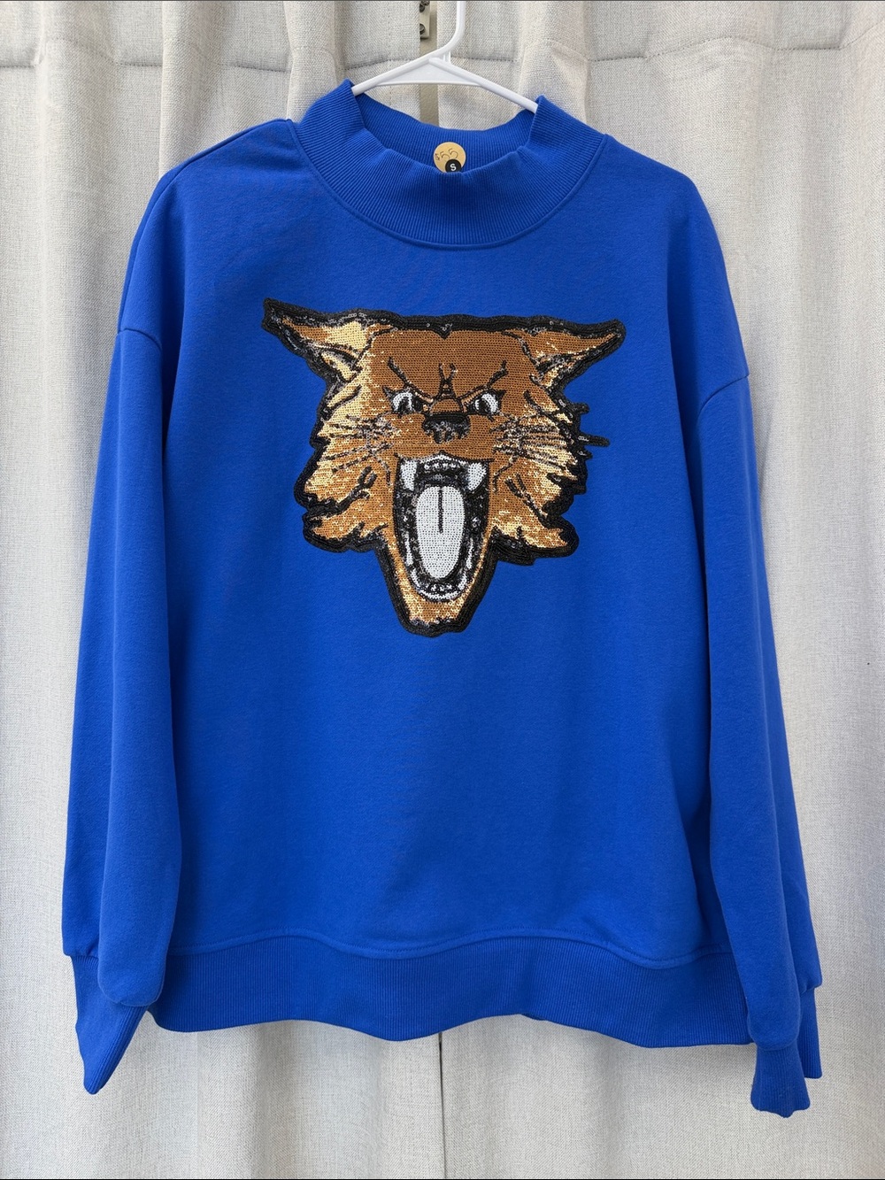 Royal Blue mockneck sweatshirt with Sequin Wildcat Patch! Runs oversized!